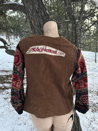 1 of 1 rework upcycled vintage brown leather vest with wool floral paisley sweater sleeves back view. SÖZ Bazaar Colorado.